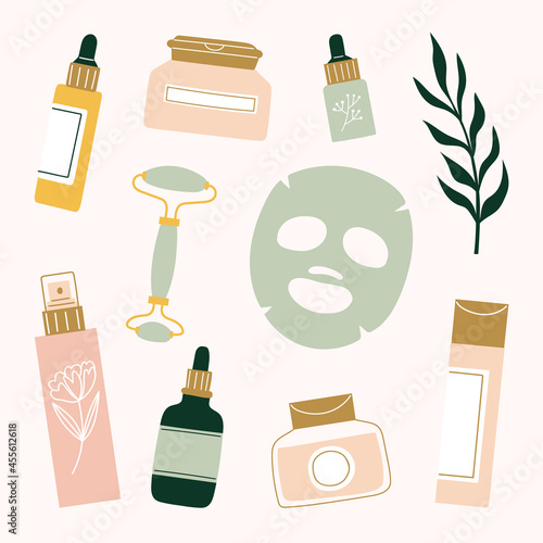 Skincare routine products sheet mask, face roller, serum, essential oil, moisturizer, mist, toner, cleansing balm and essence.