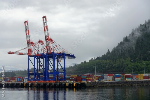 Container cranes loading shipping containers at the port in Prince Rupert, British Columbia, Canada. photo