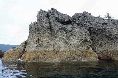 Photography The high tide line in the rocks along a formation of small rocky islands in Gwaii Haanas, Haida Gwaii, British Columbia, Canada