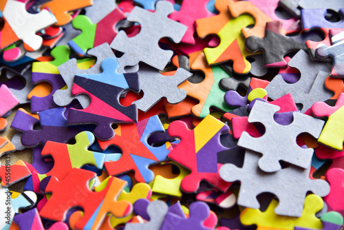 closeup heap of colorful jigsaw puzzle game