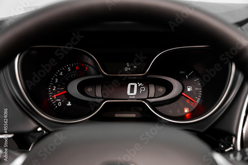 dashboard of the car is illuminated by bright illumination. Speedometer, circle tachometer, oil and fuel level © Виталий Сова
