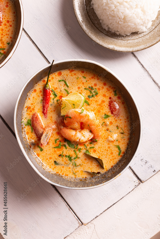 Asian food, spicy tom yum soup in a bowl Asian food, spicy tom yum soup in a bowl