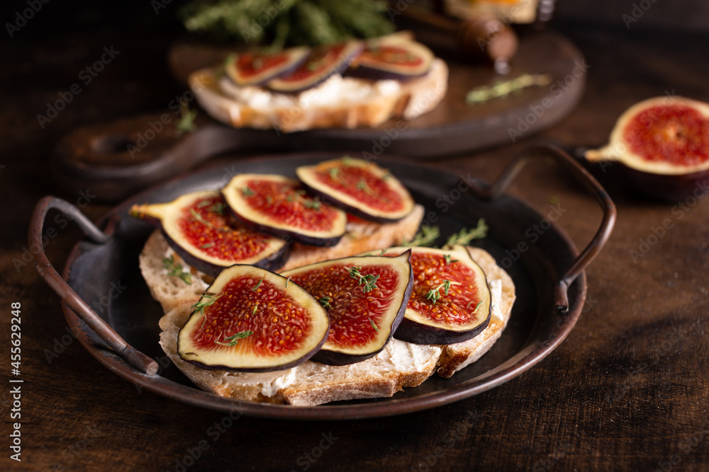 Sweet bruschetta with cream cheese and figs for breakfast Sweet bruschetta with cream cheese and figs for breakfast