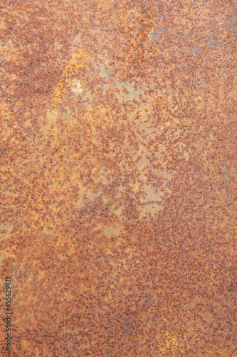 Surface of the steel plate is rusted. orange and brown color.