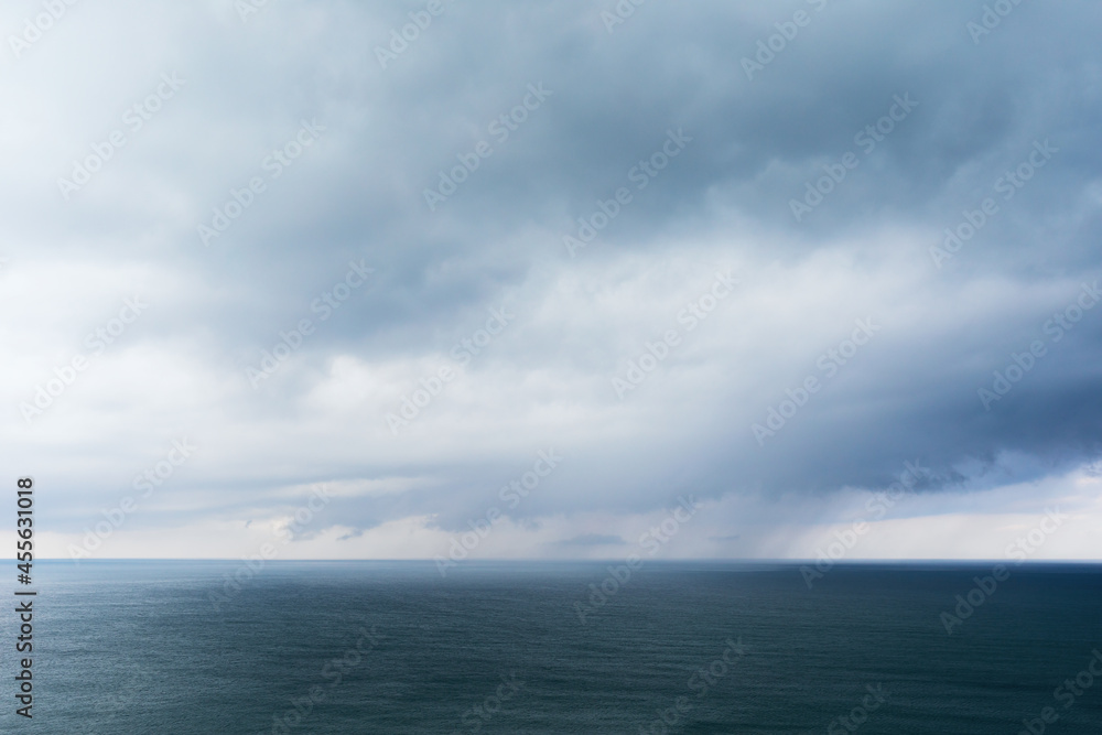 Background with rain clouds on the sea