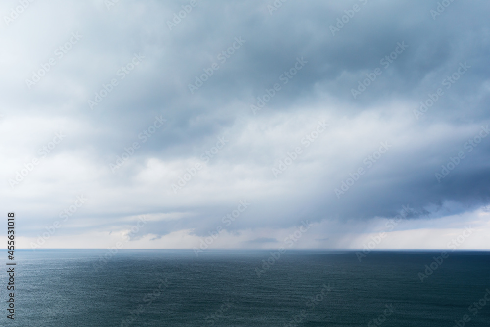 Background with rain clouds on the sea Background with rain clouds on the sea