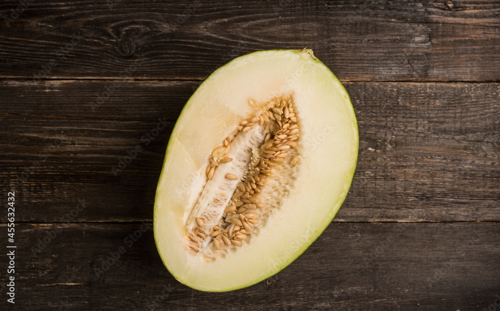 Fresh ripe melon on the rustic background. Selective focus. Fresh ripe melon on the rustic background. Selective focus.