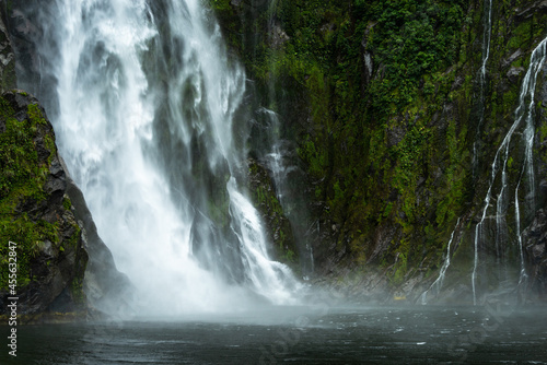 A small waterfalls alongside Stirling Falls in Milford Sound, South Island, New Zealand