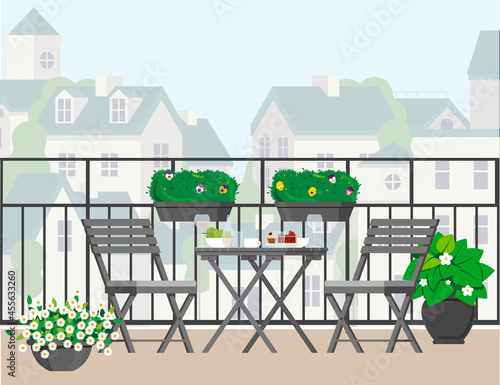 Balcony with furniture overlooking the city