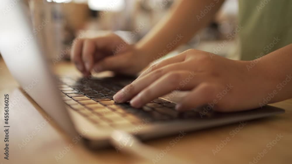 woman typing laptop in coffee shop to work online online shopping concept Working at home in the New Normal Era. woman typing laptop in coffee shop to work online online shopping concept Working at home in the New Normal Era.