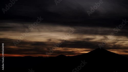 Time lapse of clouds moving over Sierra Alhamilla mountain range, Spain. Evening sunset landscape, night is falling.