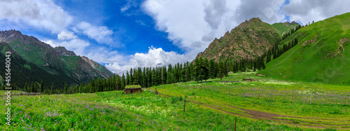 Majestic mountains and green grassland in Xiata Scenic Area,Xinjiang,China.