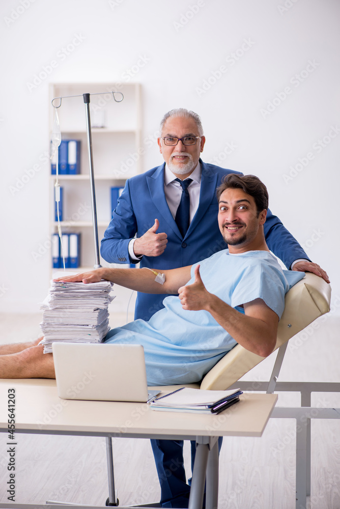 Young male employee feeling bad at workplace Young male employee feeling bad at workplace
