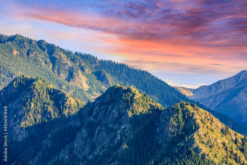 Fototapeta premium Beautiful mountain and colorful clouds natural landscape at sunset in Xinjiang,China.