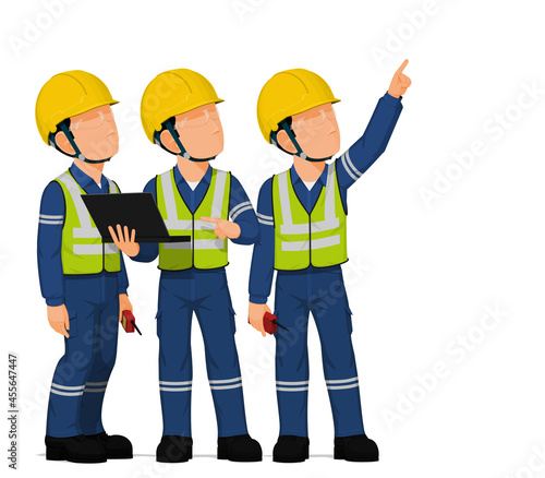 Three workers are looking at high