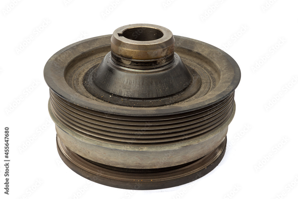 Old used engine flywheel isolated on a white background, closeup Old used engine flywheel isolated on a white background, closeup