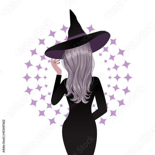 Woman in witch Halloween costume back view