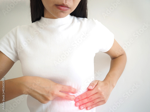 Wallpaper Mural Spleen ruptures in women. she touched her chest and experienced pain and suffering. health care concept. closeup photo, blurred. Torontodigital.ca