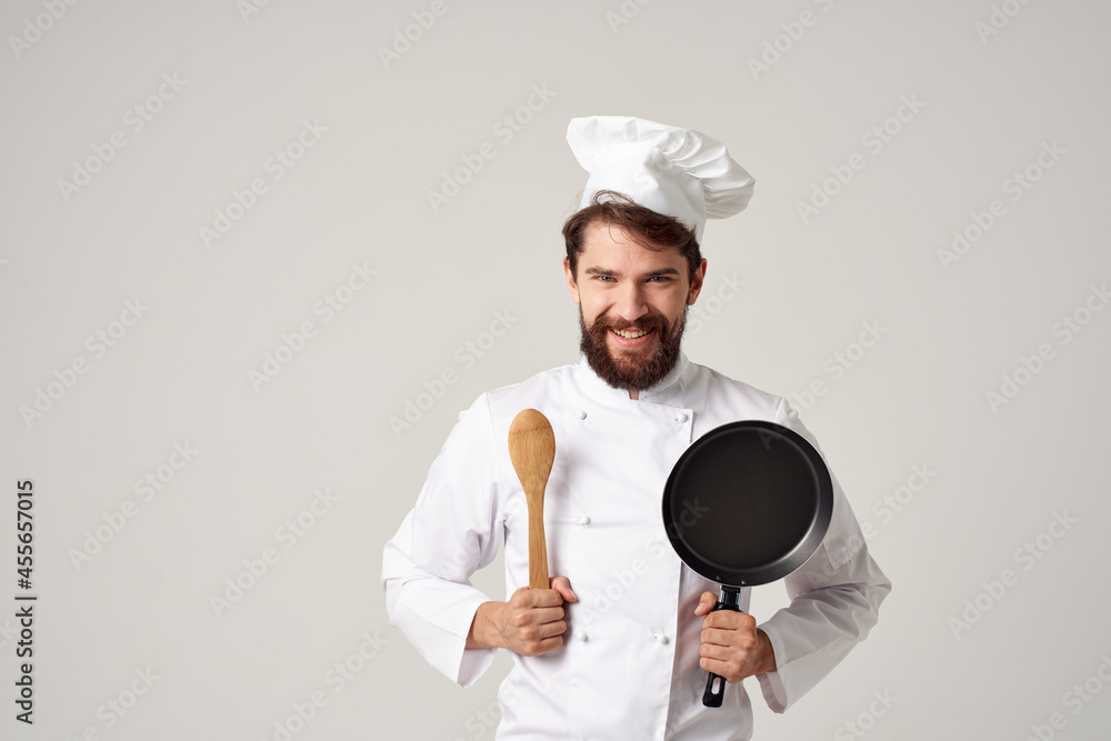 Cheerful male chef kitchen work cooking professional Cheerful male chef kitchen work cooking professional