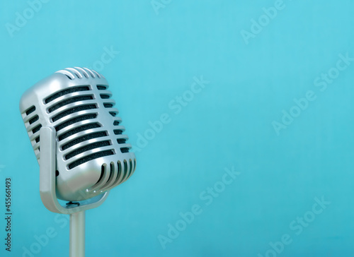Retro microphone on blue background
