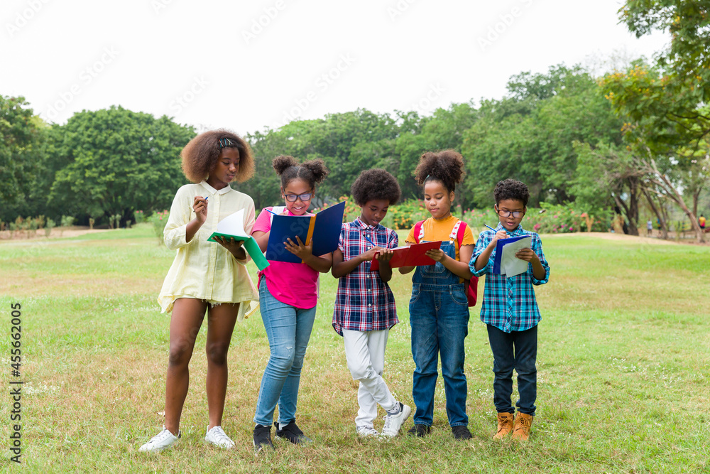 Obraz premium Cheerful of diverse kids learning outside the classroom, Friendship and Learning Concept, Student and education concept