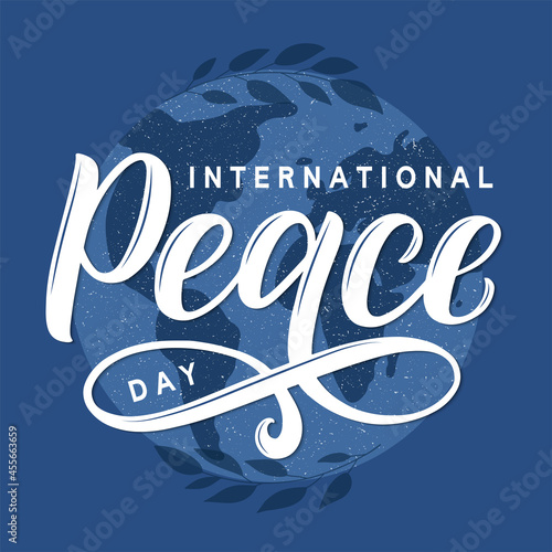 International Peace Day vector concept. Modern brush calligraphy Peace Day decorated by planet earth silhouette and tree branches.