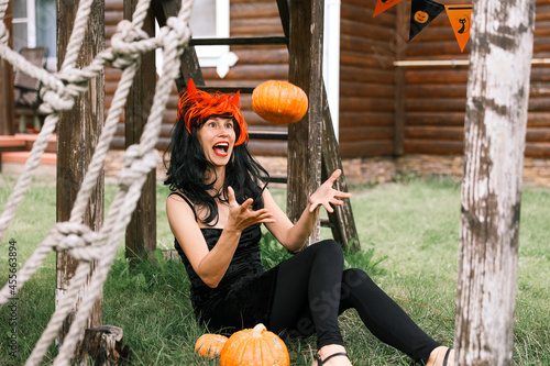 Pretty woman in witch costume at halloween party