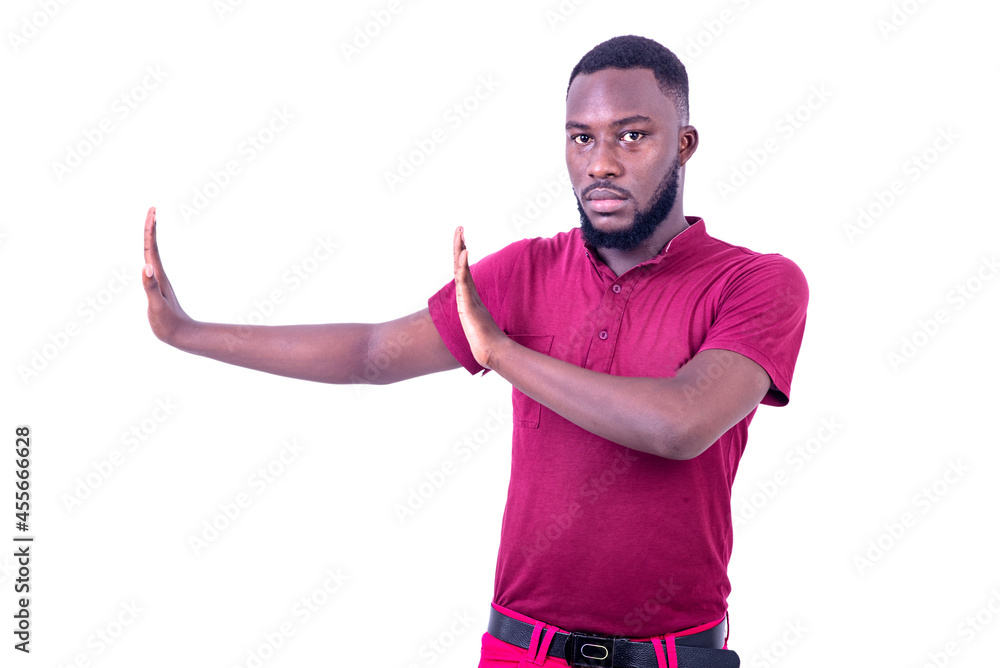 handsome young man making a stop gesture with hands aside. handsome young man making a stop gesture with hands aside.