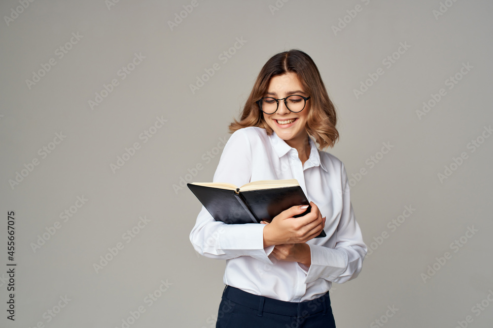 female manager with folder for papers Professional light background female manager with folder for papers Professional light background
