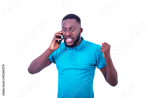 handsome furious young man talking on mobile phone.