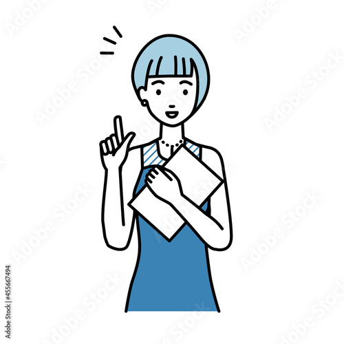 立って書類を手に持って何かひらめいたドレスの女性