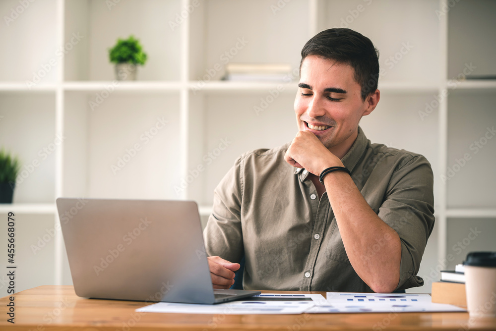 business man happily discussing work through laptop business man happily discussing work through laptop