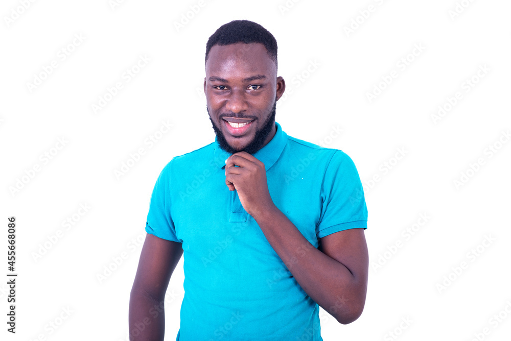handsome young man holding beard with hand smiling. handsome young man holding beard with hand smiling.