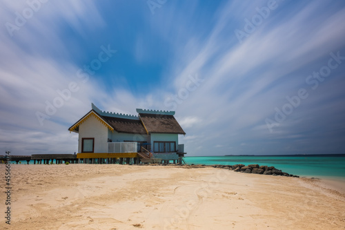 Crossroads Maldives  july 2021  view of luxury overwater villa  that lie within a sparkling turquoise lagoon offering views of either sunrise or sunset  beach or ocean view. Long exposure picture