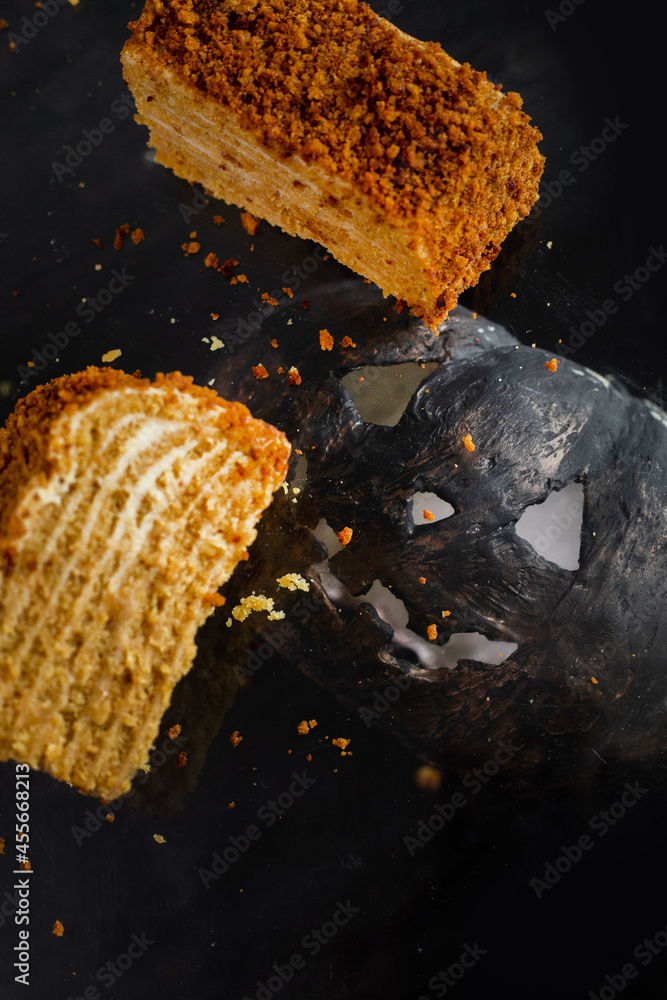 Fototapeta premium Halloween cake with a pumpkin . vegan honey cake. levitation