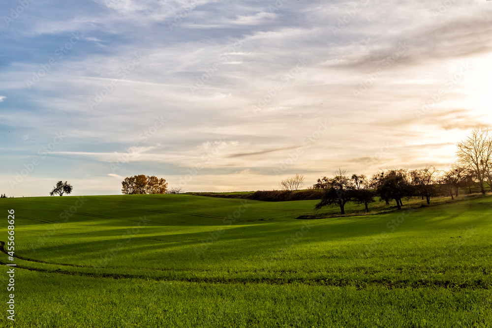 sunset over fields in beautiful landscape in the rural countryside of Baden-Württemberg Germany