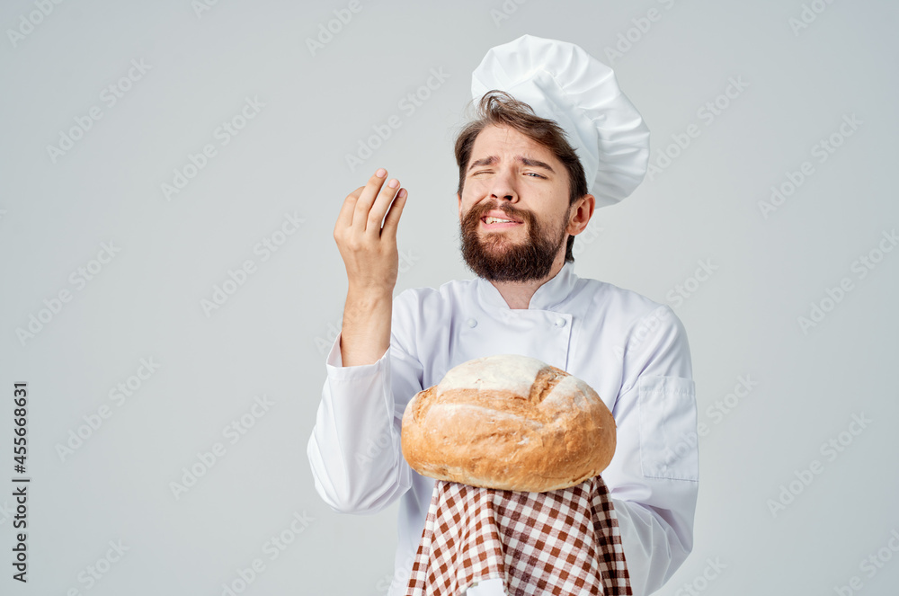 male cook with bread in hand Professional emotions male cook with bread in hand Professional emotions