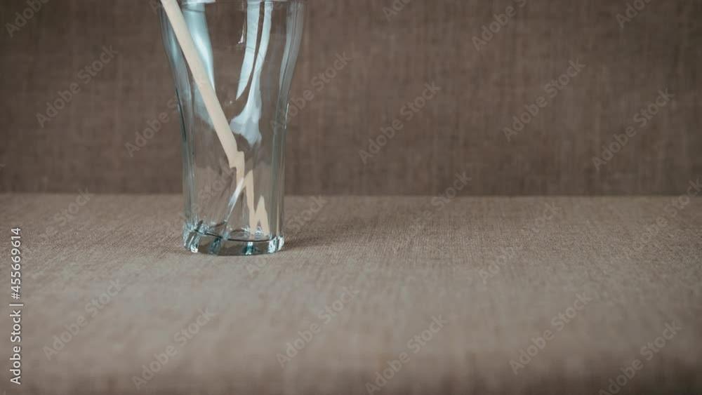 Reusable drinking straw. A view of a reusable straw in the glass in the room. Reusable drinking straw. A view of a reusable straw in the glass in the room.