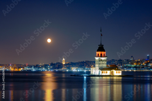 Maiden's Tower and Galata Tower at night with full moon.