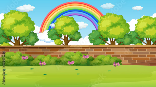 Park landscape scene with rainbow in the sky