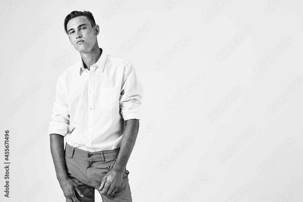 Fototapeta premium handsome man in white shirt fashion hairstyle studio lifestyle