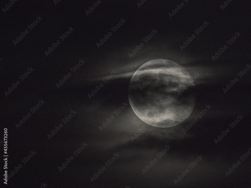 the mysterious moon is hidden behind a thin veil of clouds the mysterious moon is hidden behind a thin veil of clouds