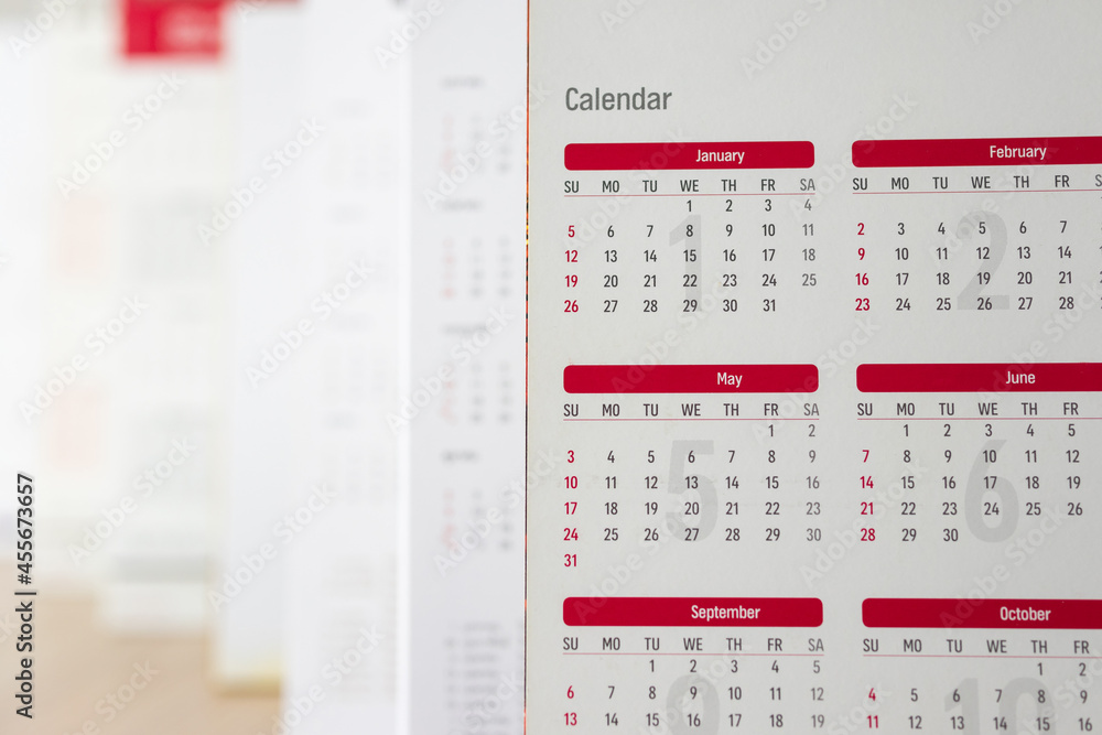Close up calendar page dates and month background business planning appointment meeting concept Close up calendar page dates and month background business planning appointment meeting concept