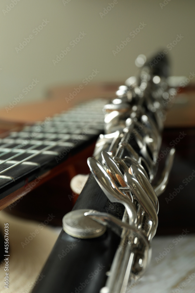 Fototapeta premium Classical guitar, clarinet and hat, close up and selective focus