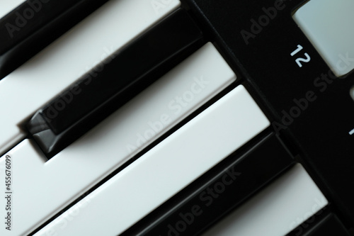Midi keyboard all over background, close up