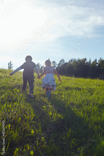 cute kids are walking in fields