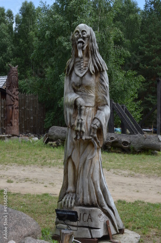 Wooden sculpture of slavic beast - Striga photo
