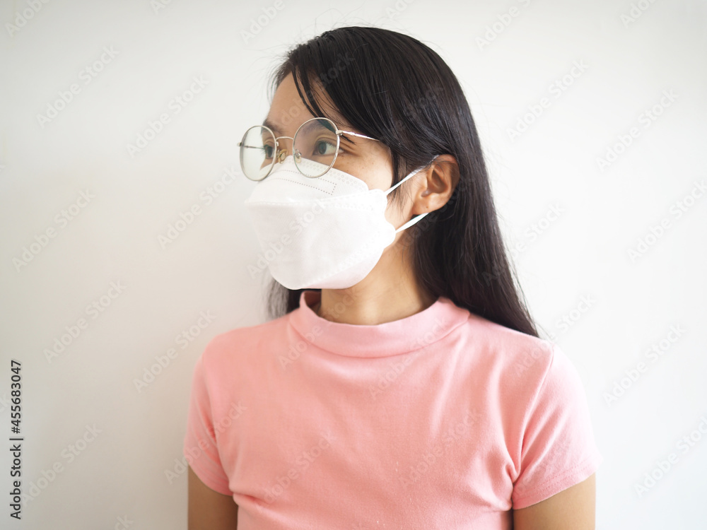Asian women wear masks to prevent COVID-19 bacteria and dust pm2.5 on white background. Asian women wear masks to prevent COVID-19 bacteria and dust pm2.5 on white background.
