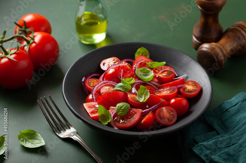 healthy tomato salad with onion basil olive oil and balsamic vinegar