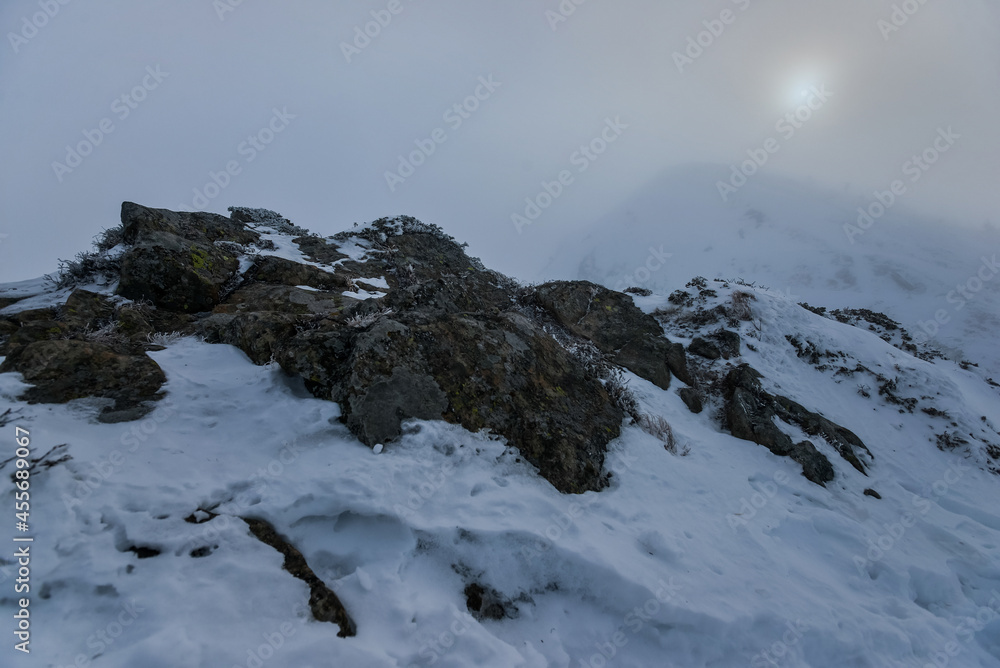 Daylight winter landscape with rocks